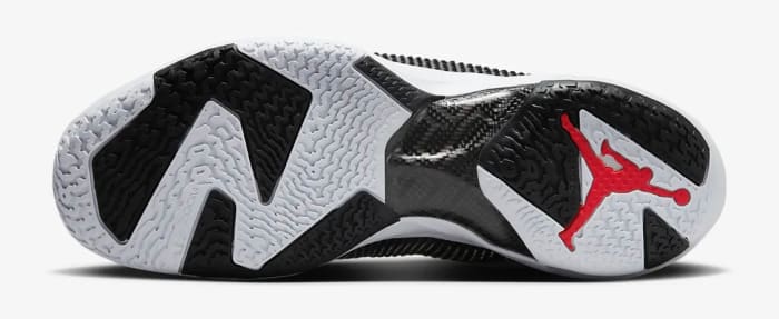 View of white, lack, and red Air Jordan shoe.